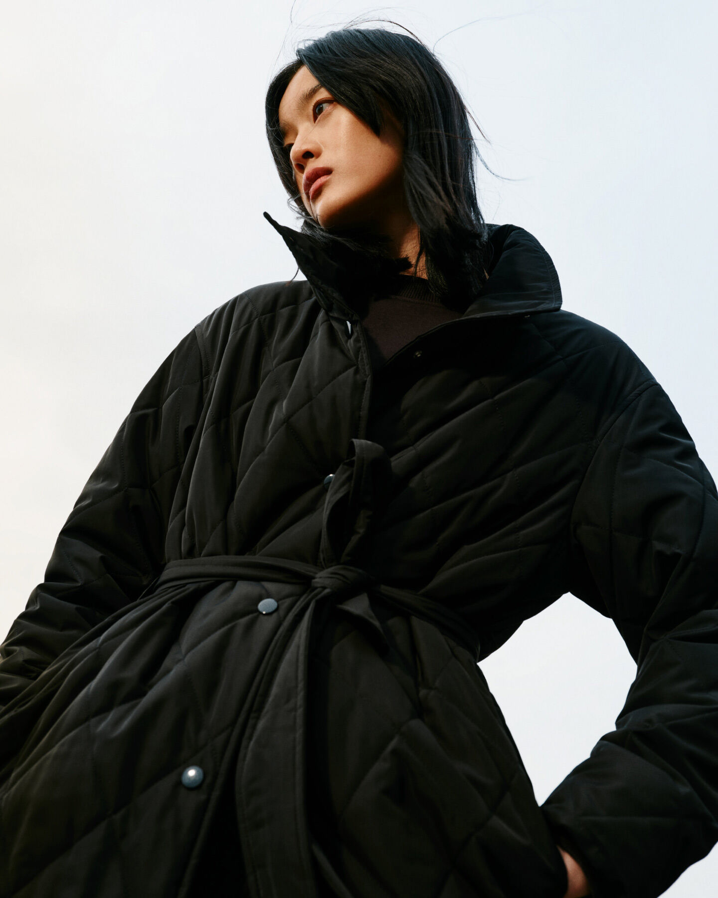 Woman wearing Quilted Coat in black
