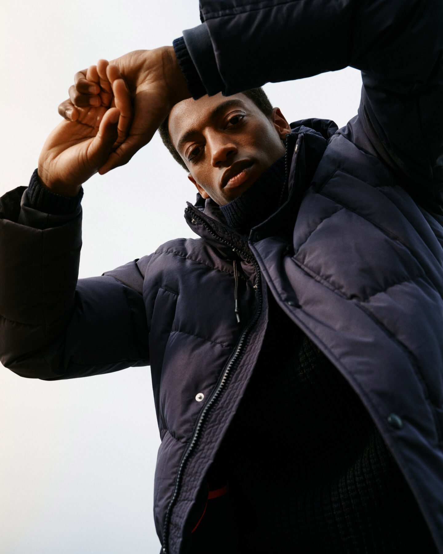 Man wearing Alta Down Jacket in evening blue