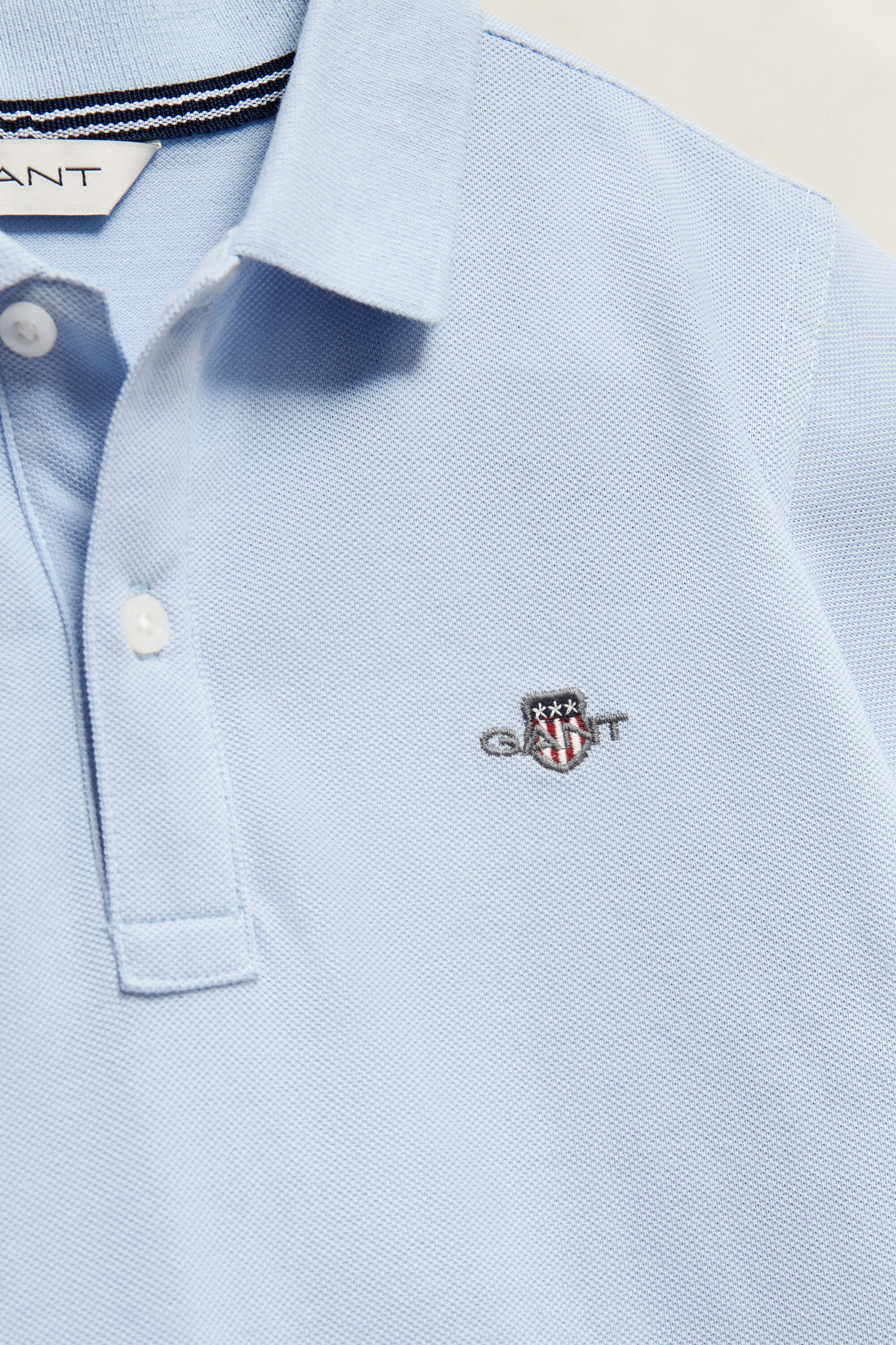 Poloshirt met schild voor tieners