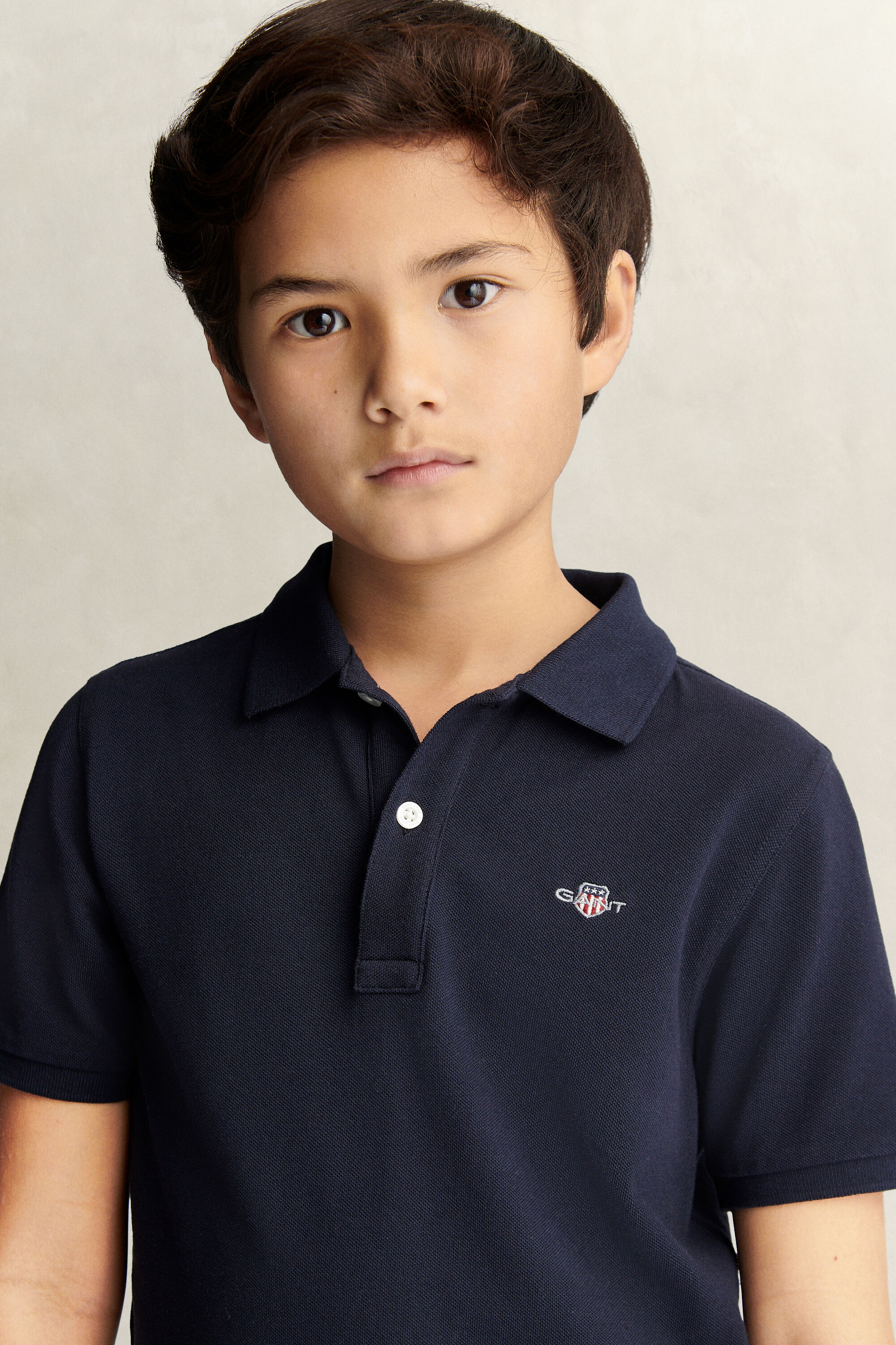Poloshirt met schild voor tieners