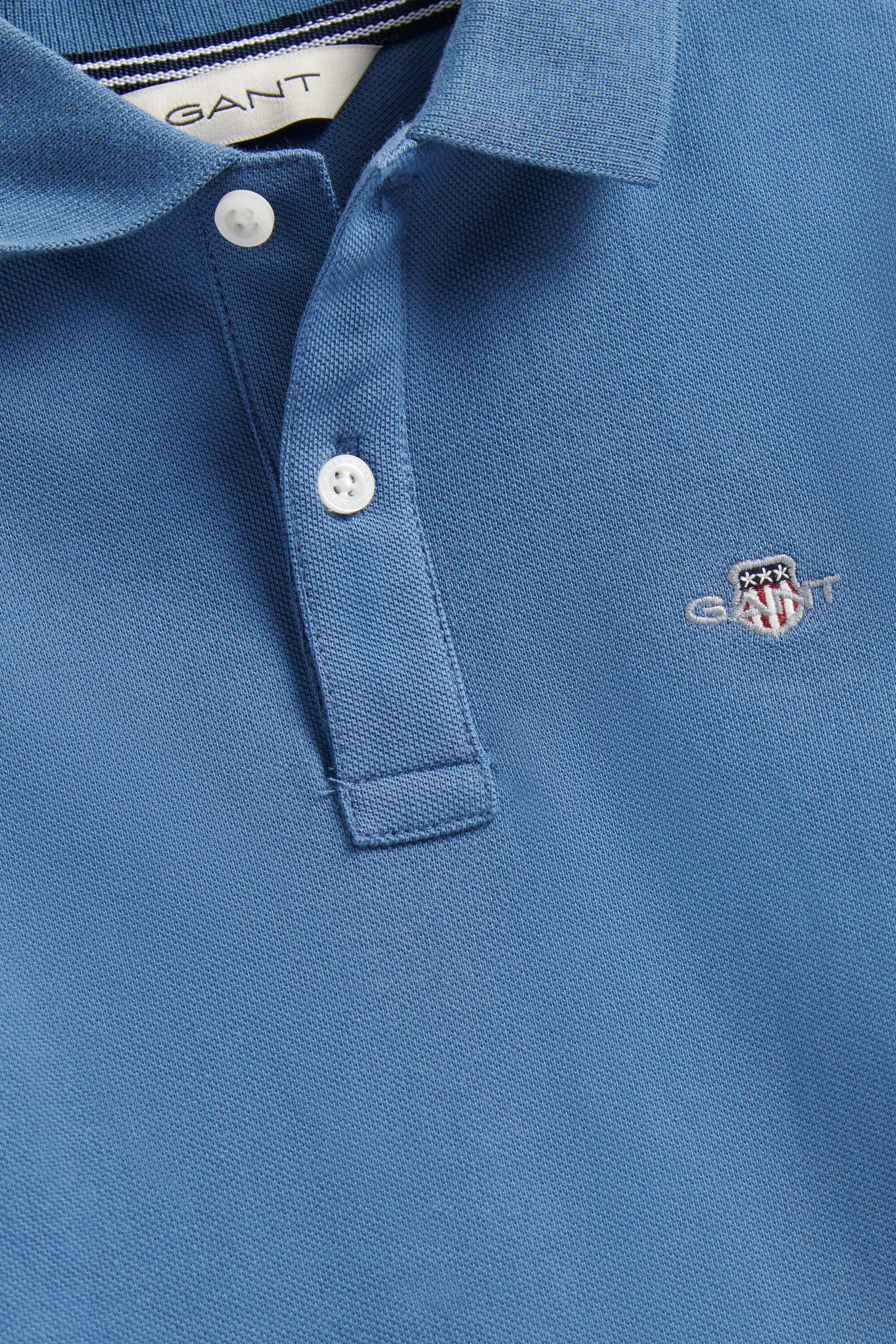 Poloshirt met lange mouwen en schild voor jongens