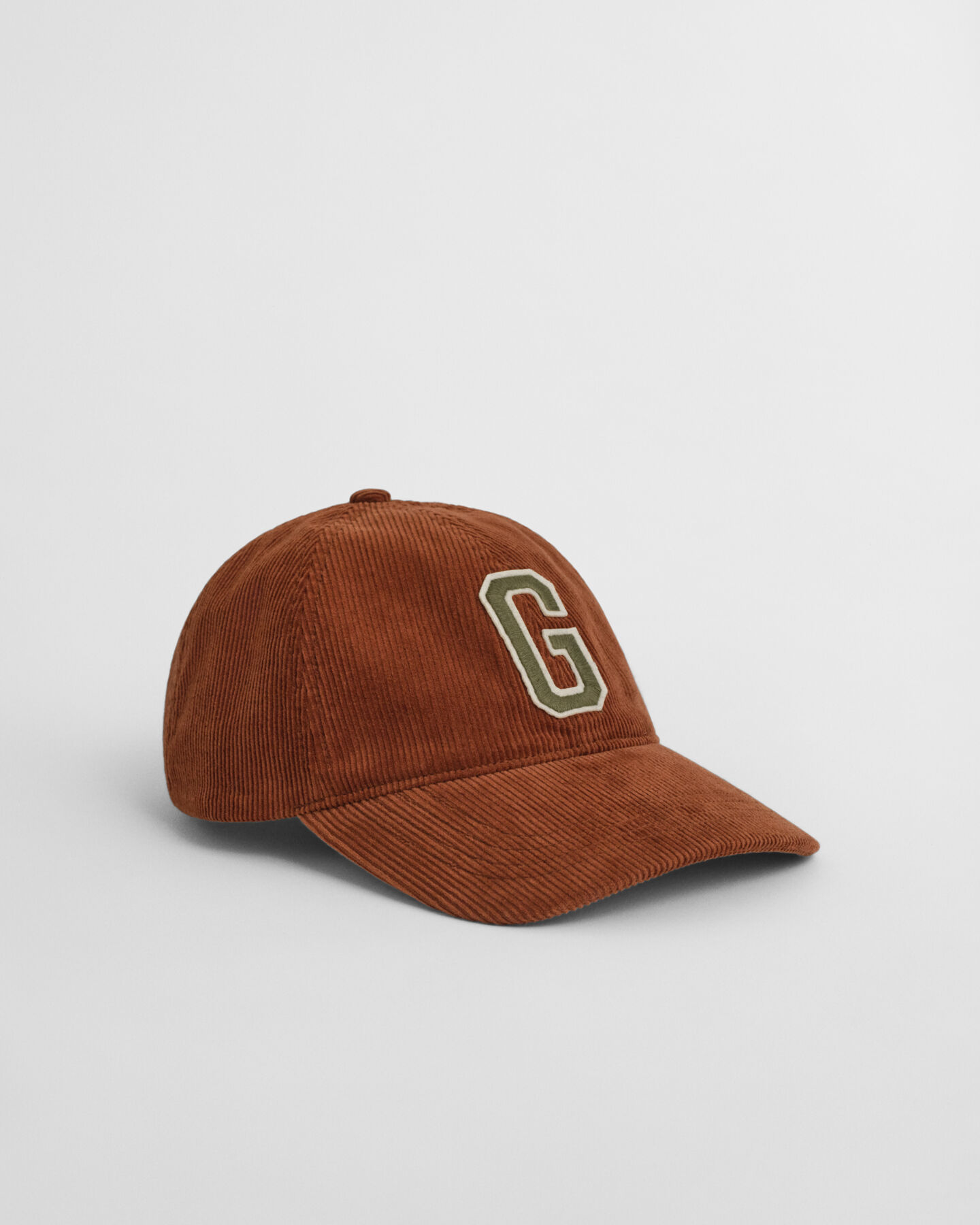 Corduroy pet met G-badge