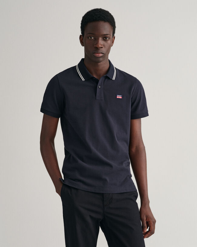 Piqu&eacute; poloshirt met contrasterende kraag met streepjes