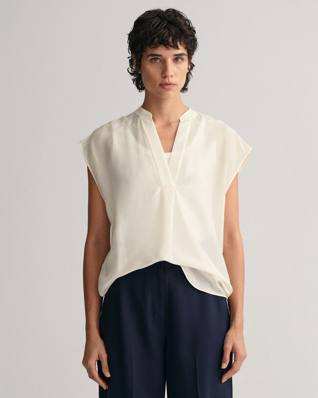 Mouwloze blouse met opstaande kraag