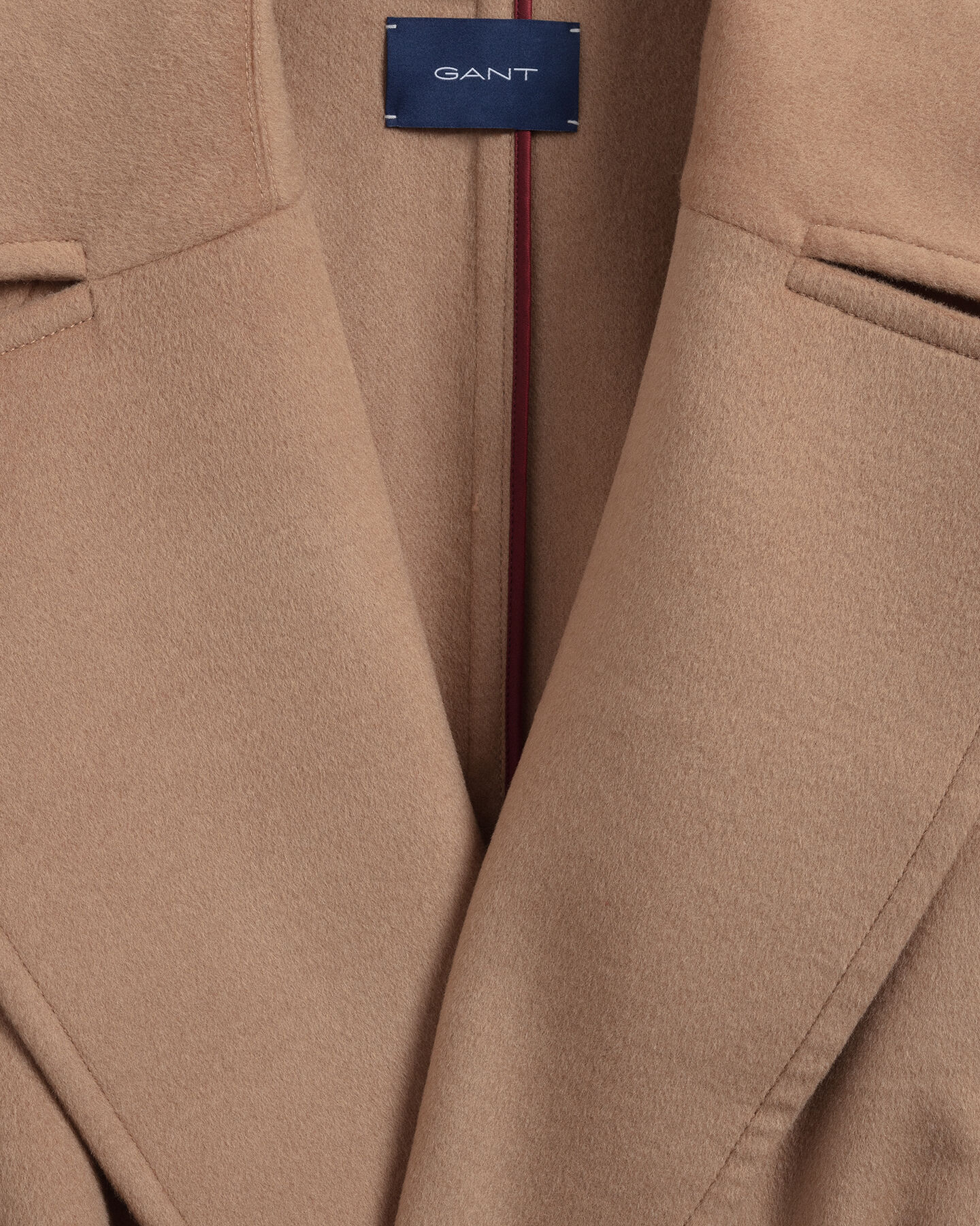 Jas van wolmix met ceintuur