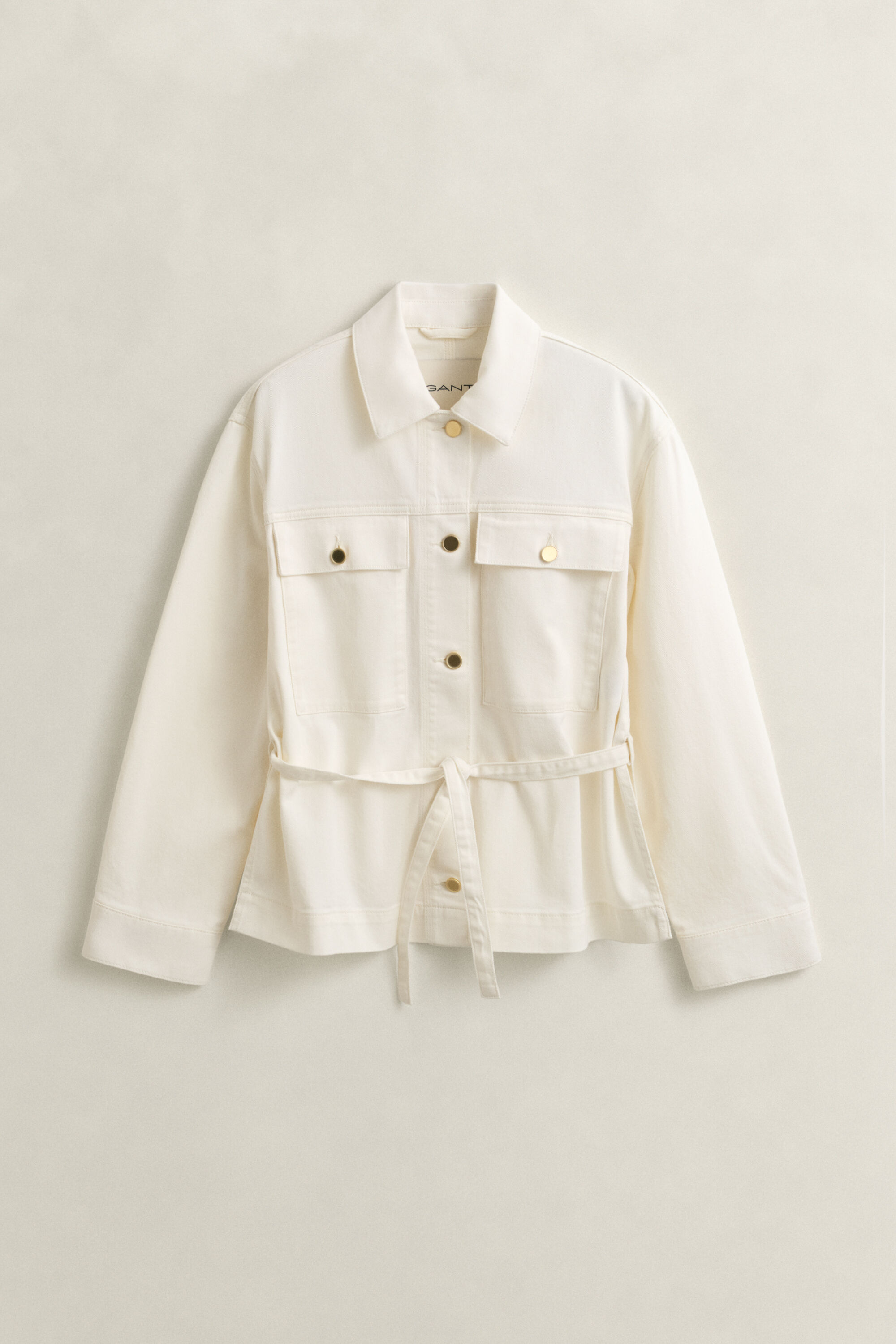 Spijkerjasje met strikdetails