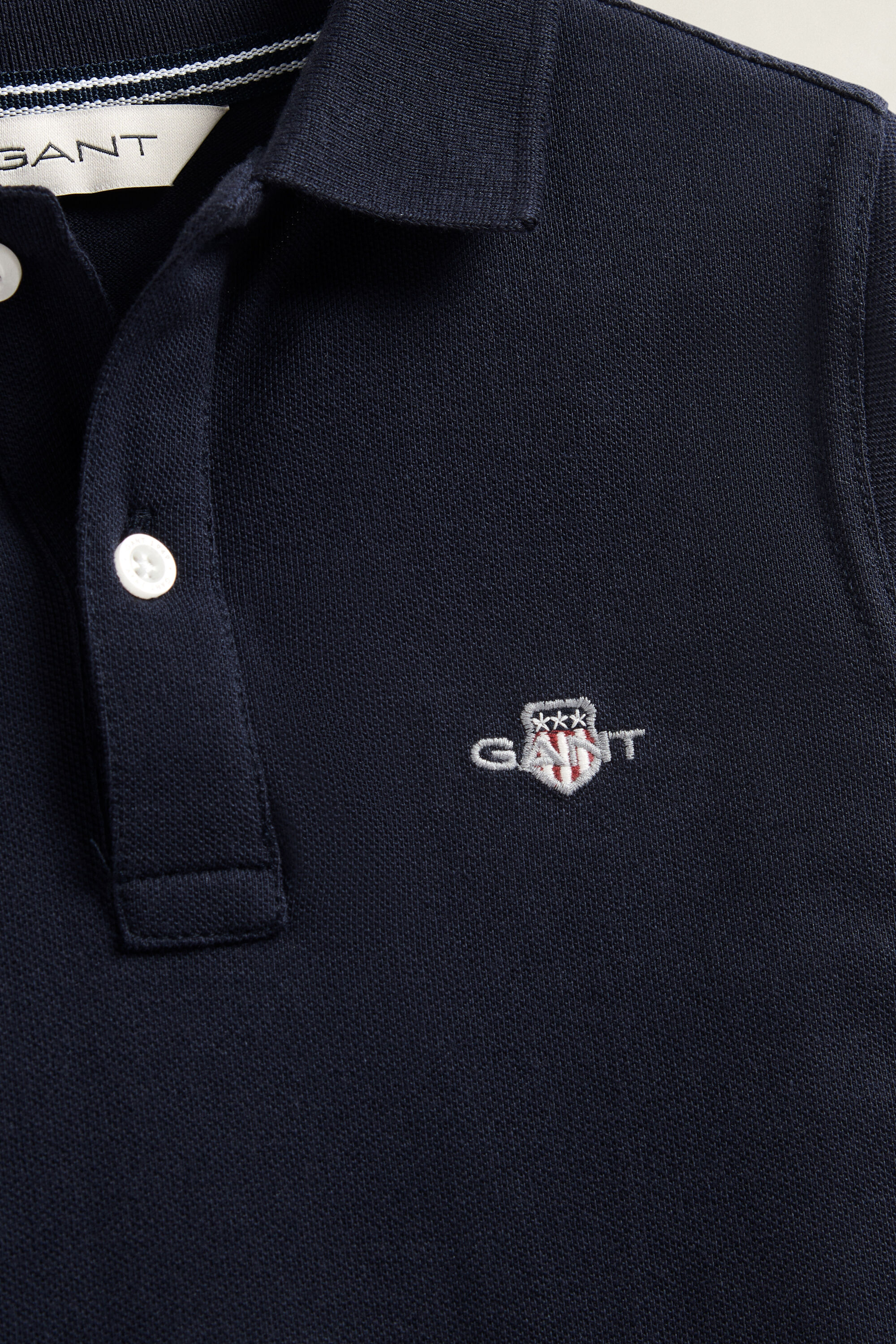 Poloshirt met lange mouwen en schild voor jongens