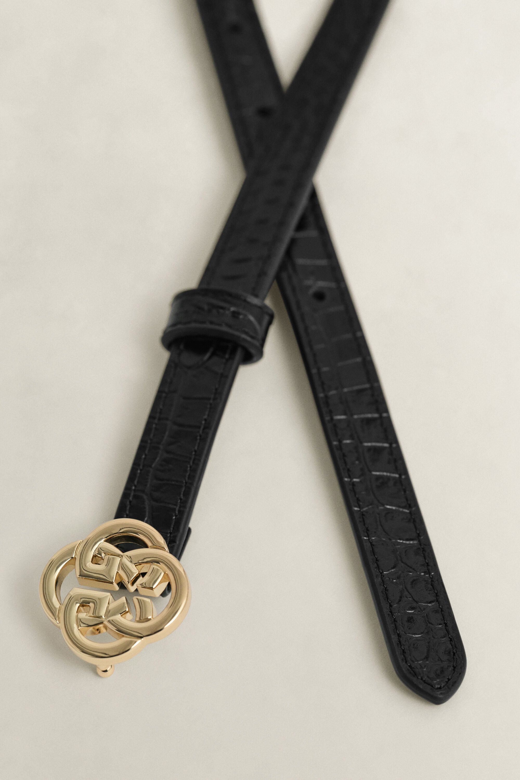 Riem met krokodillenlook en monogram