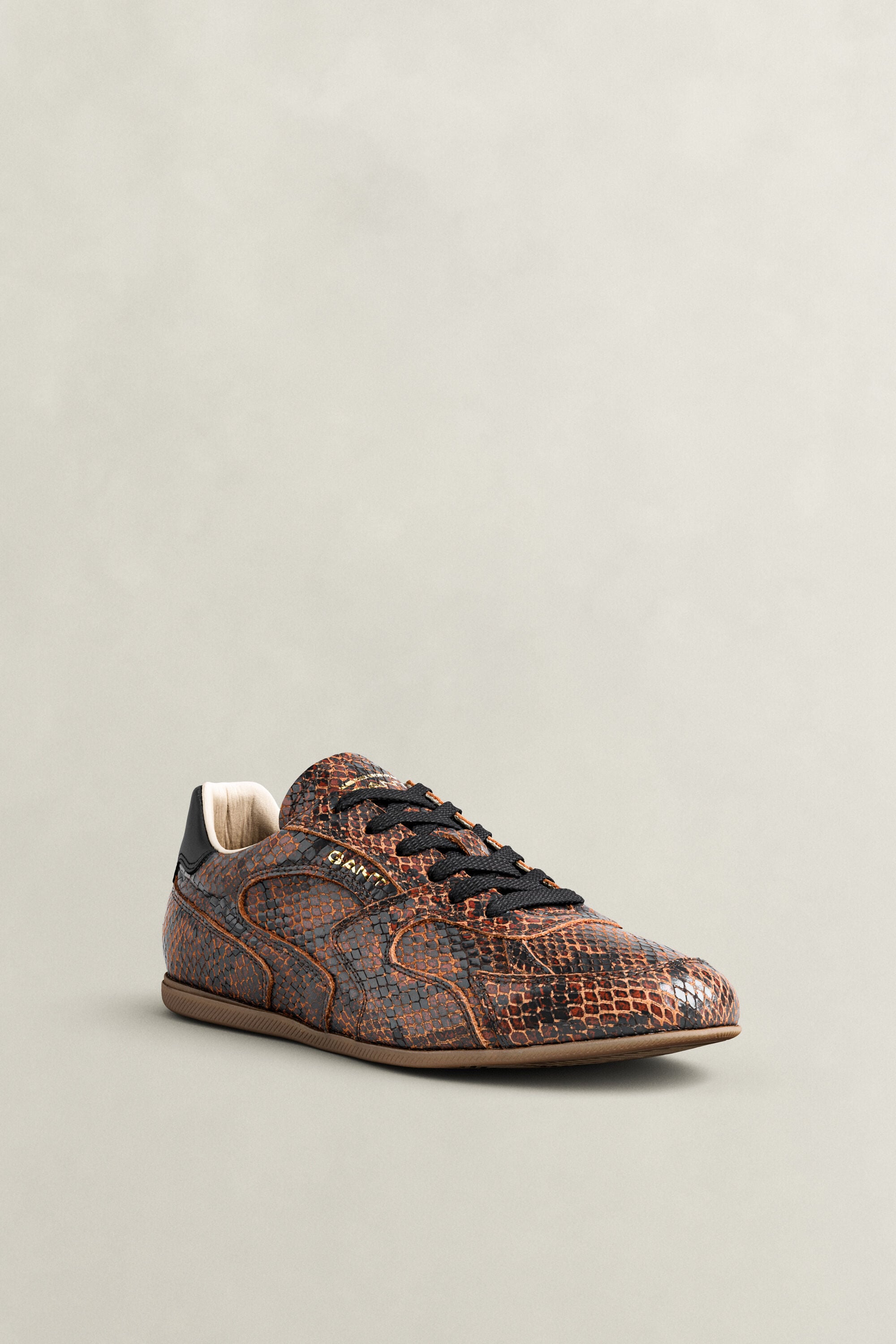 Sperly leren sneakers met slangeneffect