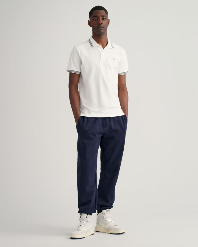 Piqu&eacute; poloshirt met biesjes met visgraatmotief