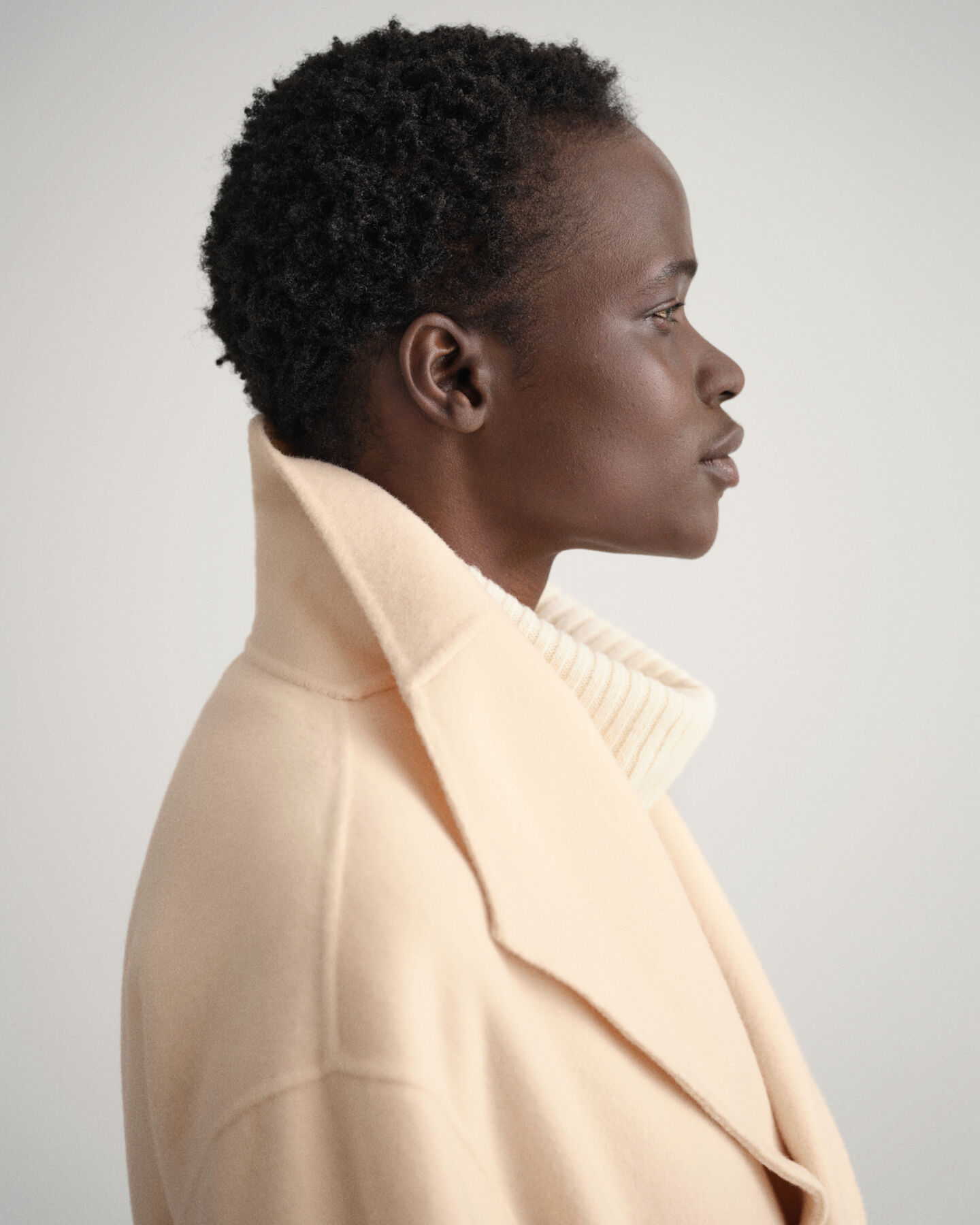 Met de hand gestikte jas met ceintuur