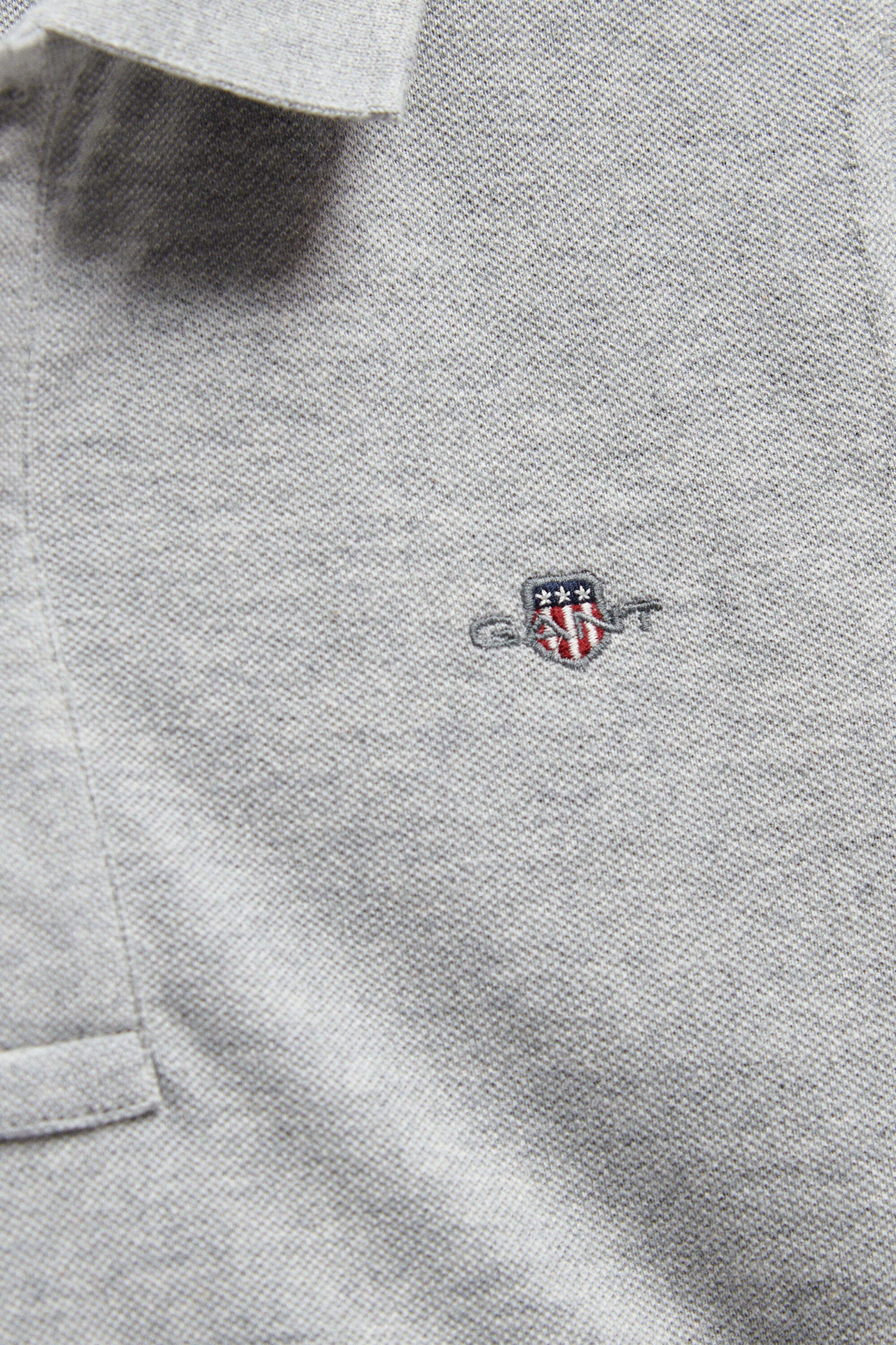 Poloshirt met schild voor tieners