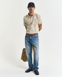 Poloshirt met tropische print