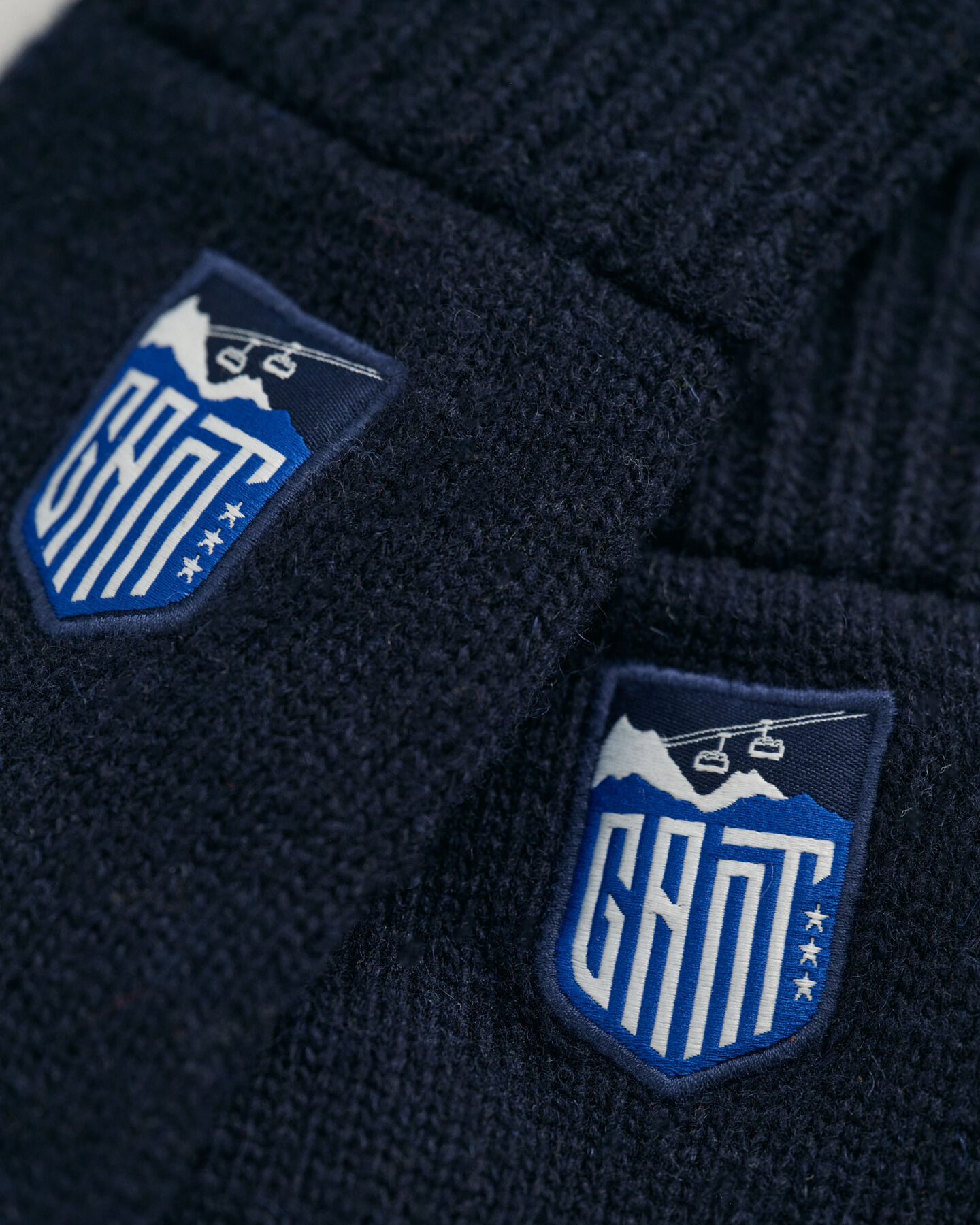 Teens Alpine gebreide handschoenen met badge