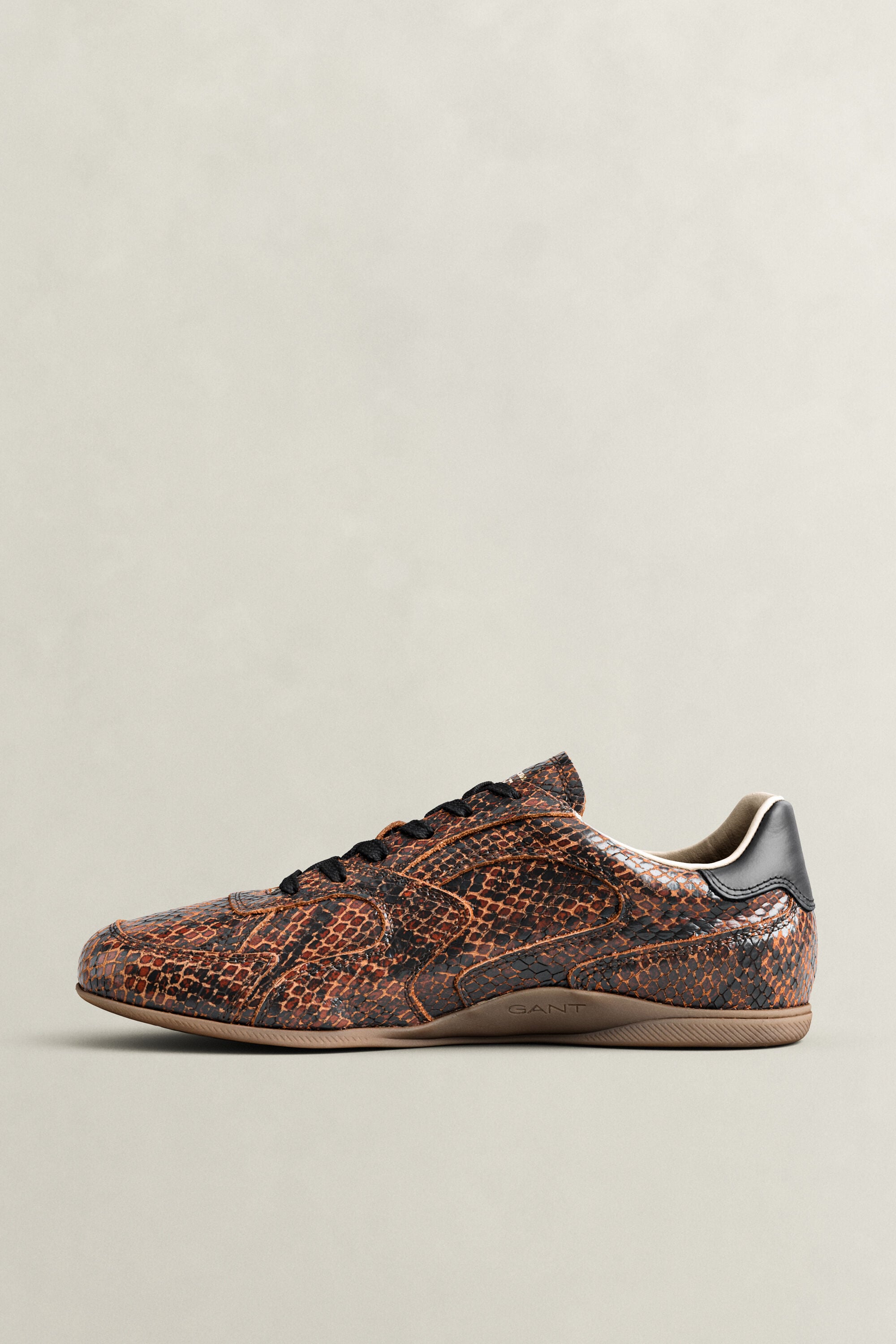 Sperly leren sneakers met slangeneffect