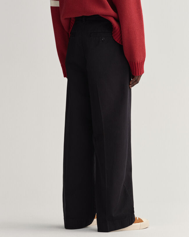 Volume chino met plooien