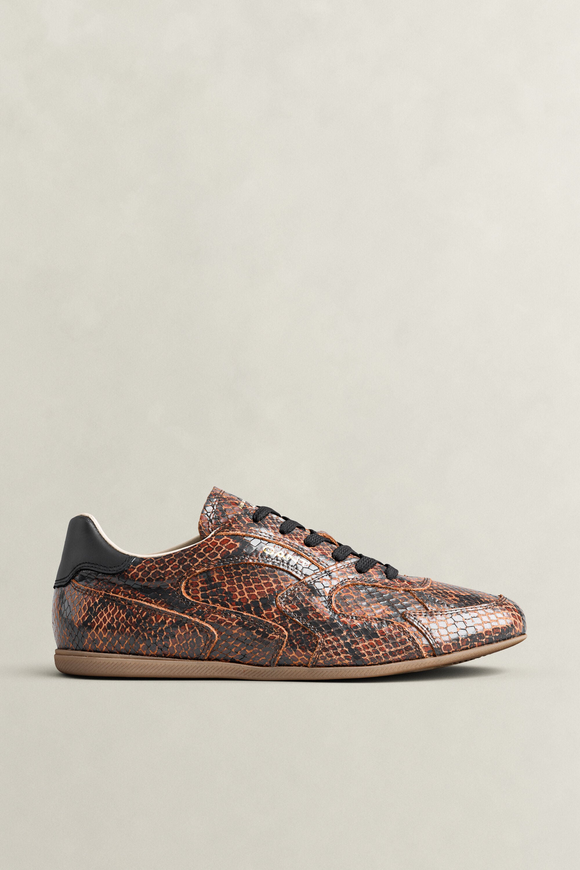 Sperly leren sneakers met slangeneffect