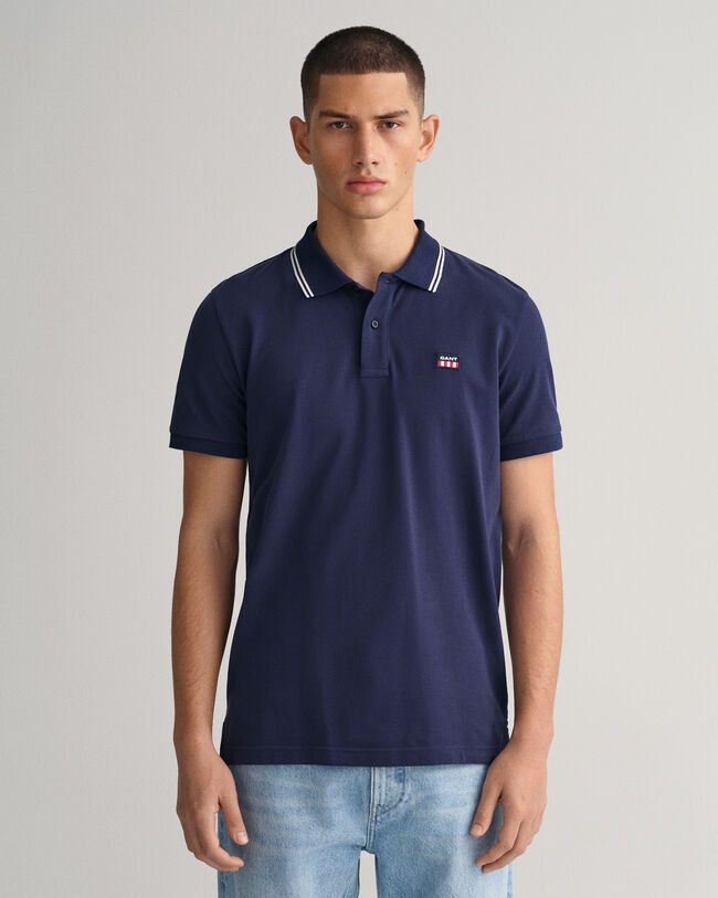 Piqu&eacute; poloshirt met contrasterende kraag met streepjes