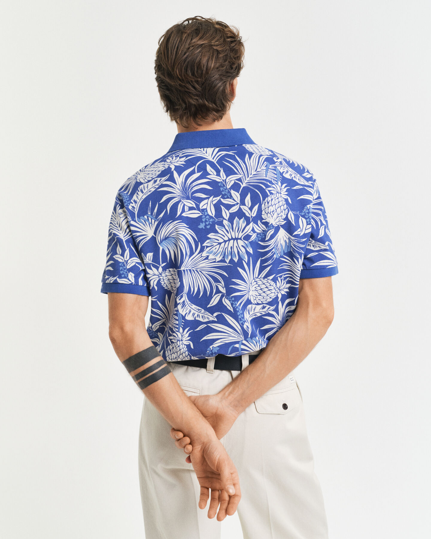 Poloshirt met tropische print