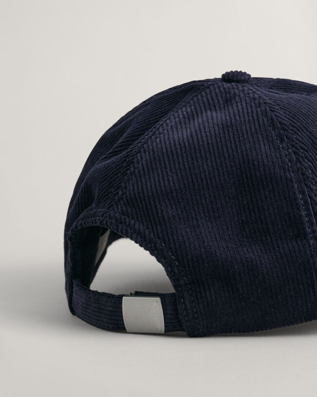 Corduroy pet met G-badge