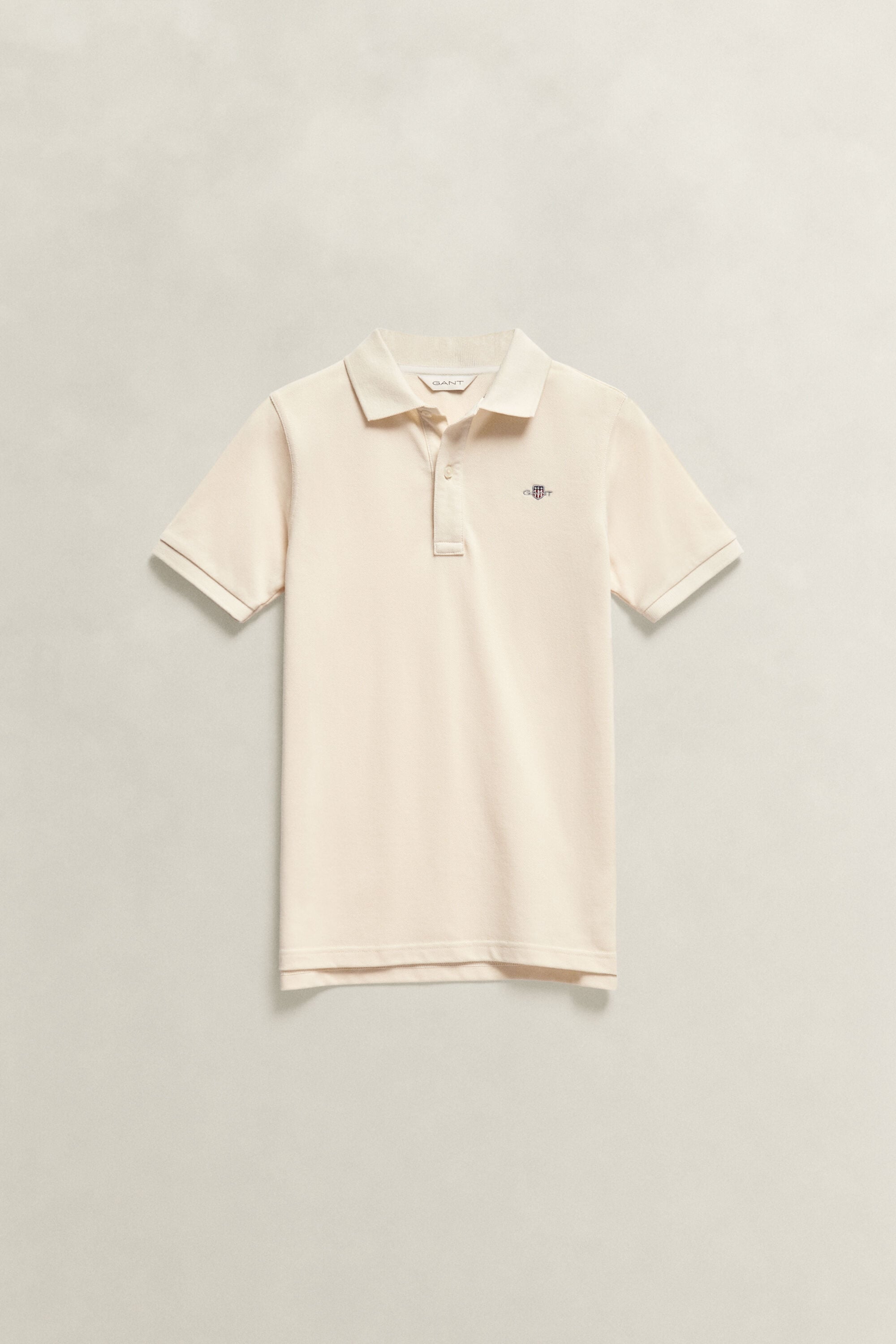 Poloshirt met schild voor tieners