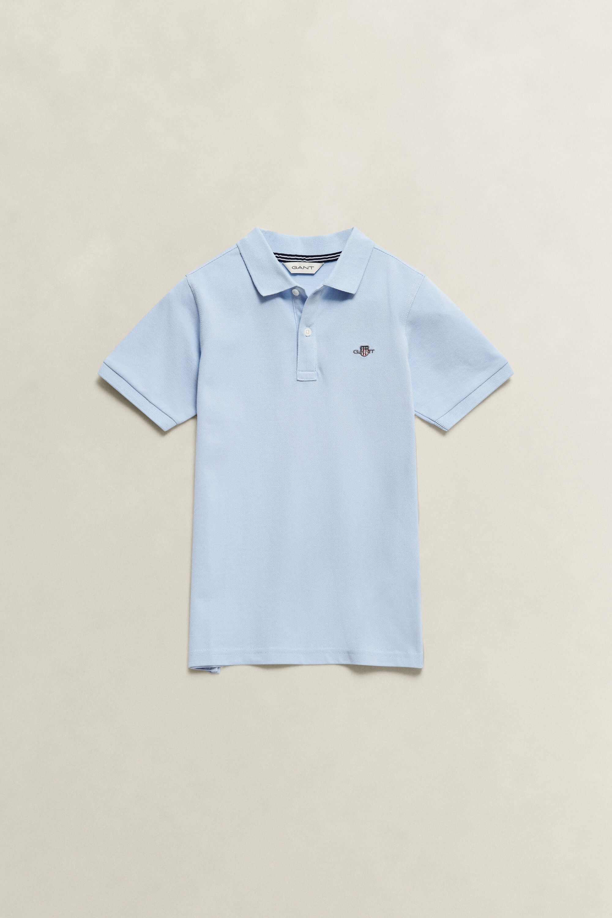 Poloshirt met schild voor tieners