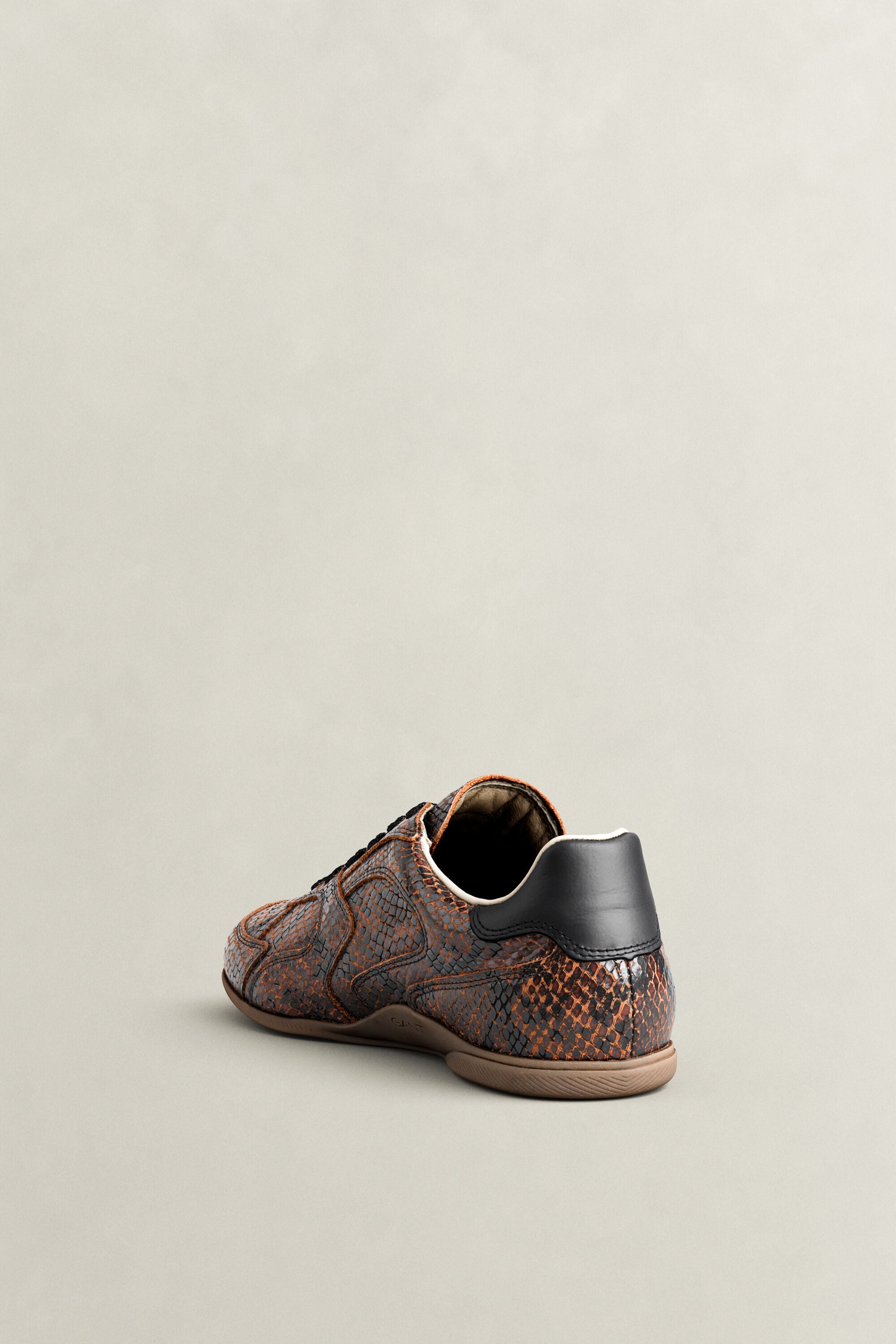 Sperly leren sneakers met slangeneffect