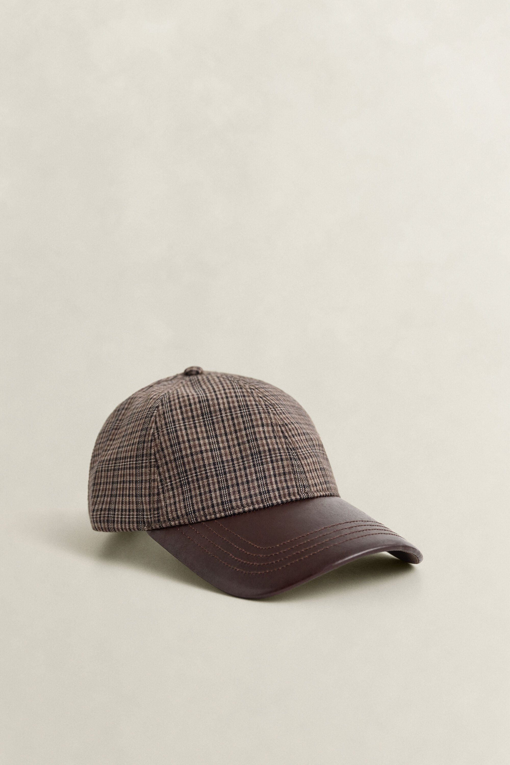 Geruite wollen pet met leren klep