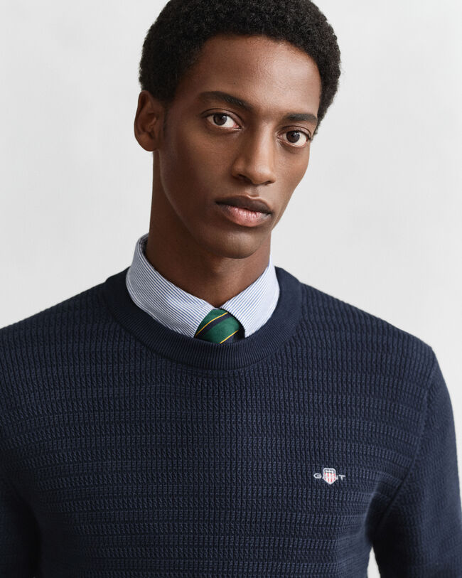 Gebreide trui met minikabels en ronde hals