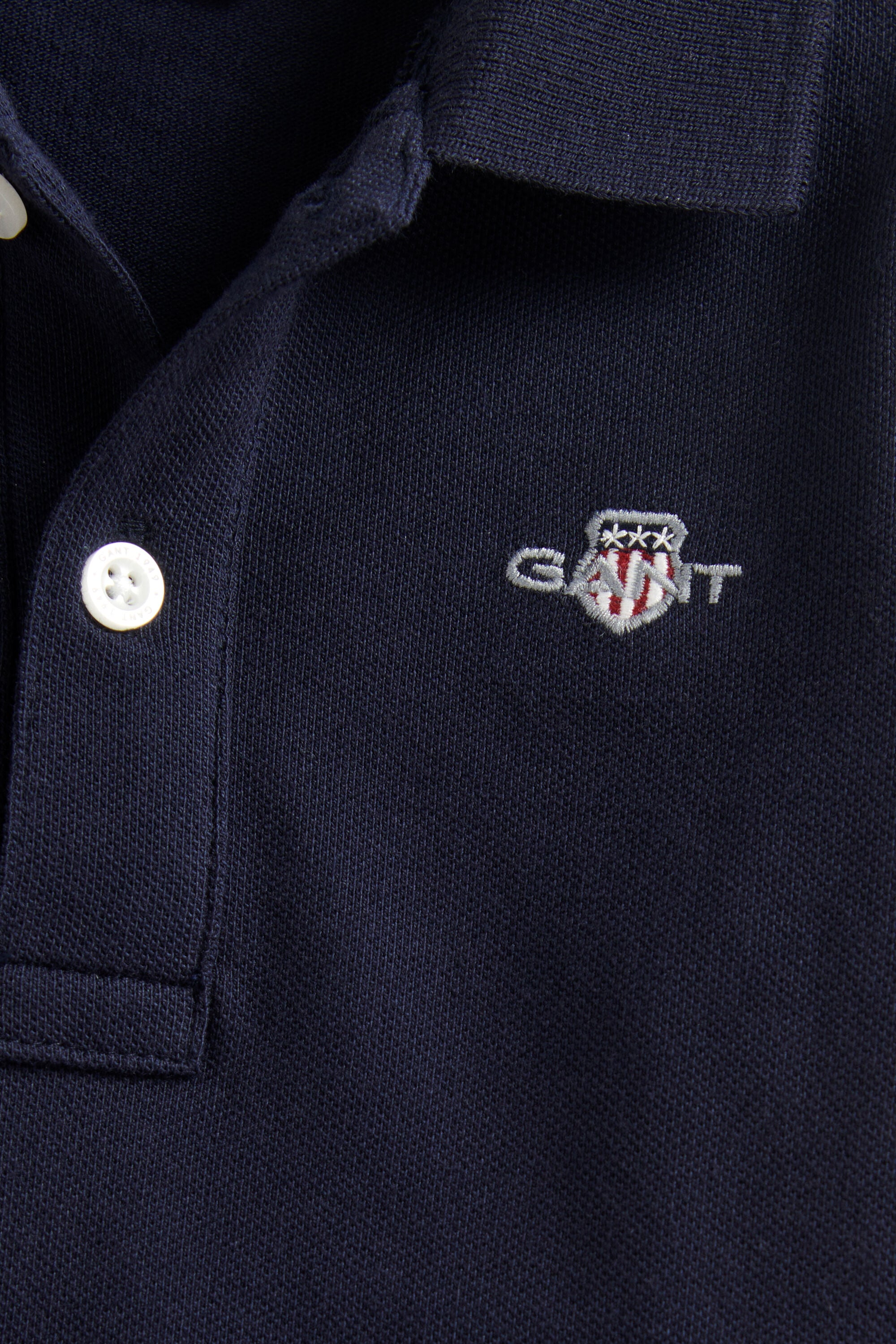 Poloshirt met lange mouwen en schild voor jongens