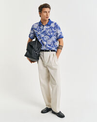 Poloshirt met tropische print